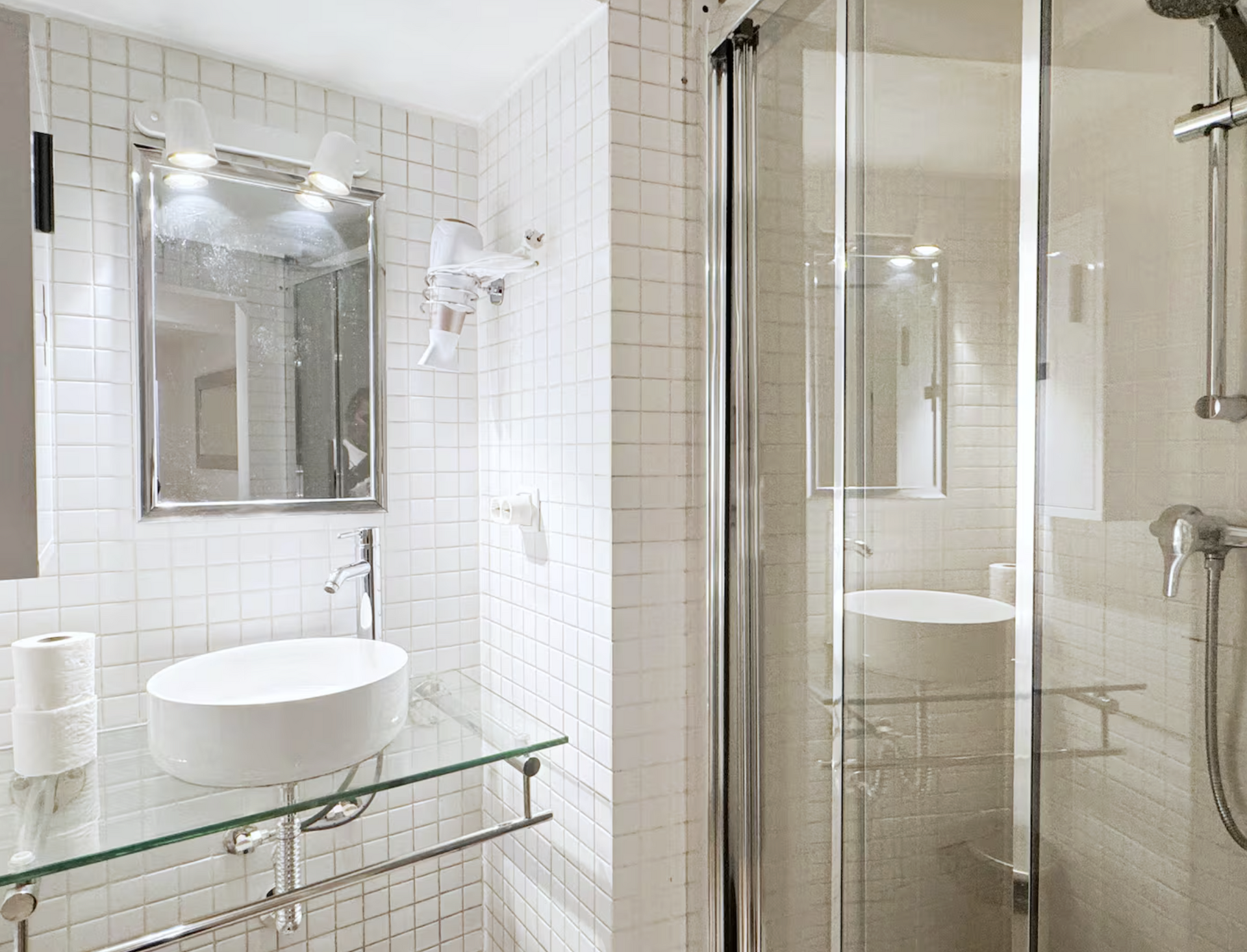 White tiled bathroom with shower
