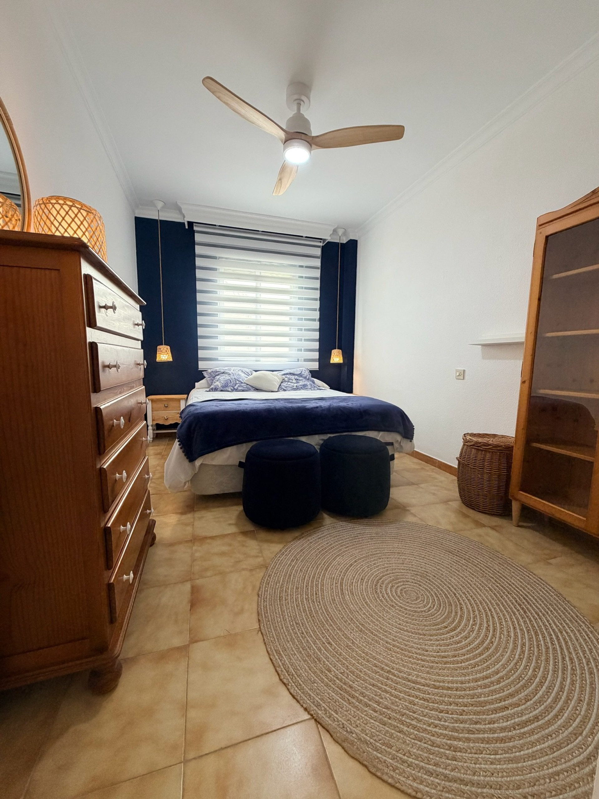 Master bedroom with navy accent wall