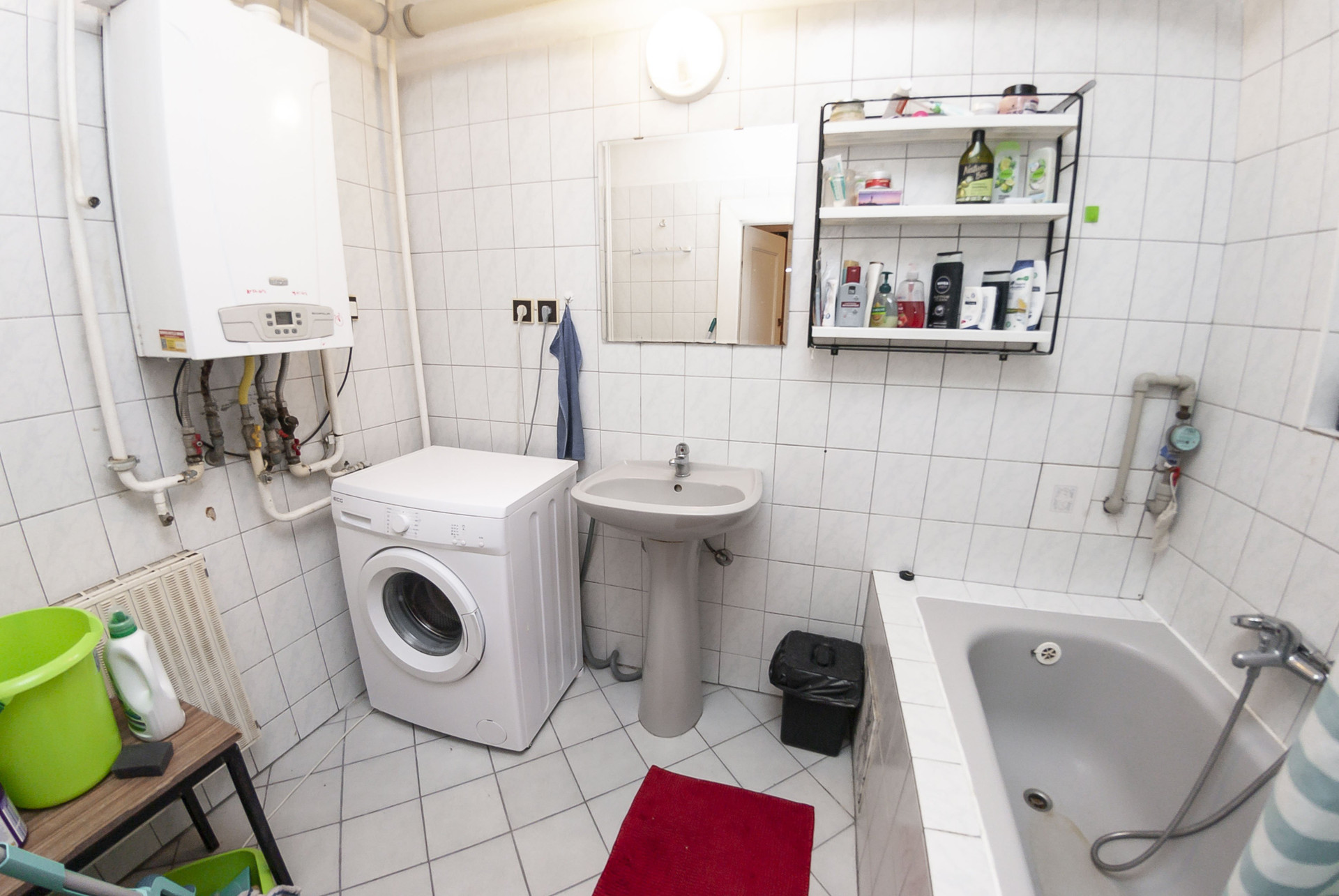 Bathroom with tub and washing machine