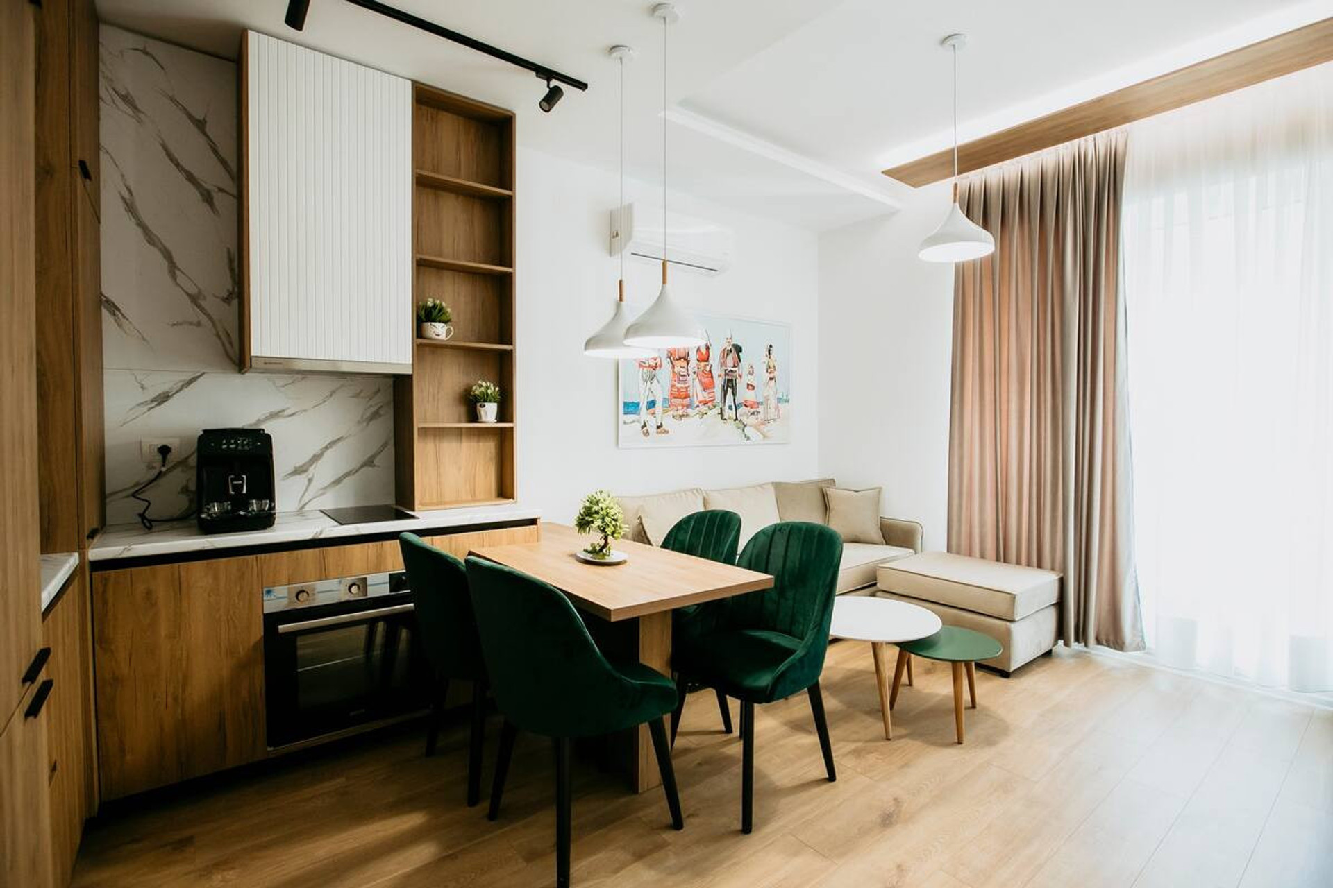 The large glass doors connecting the room to the balcony let in plenty of natural light, instantly creating a feel-good atmosphere.