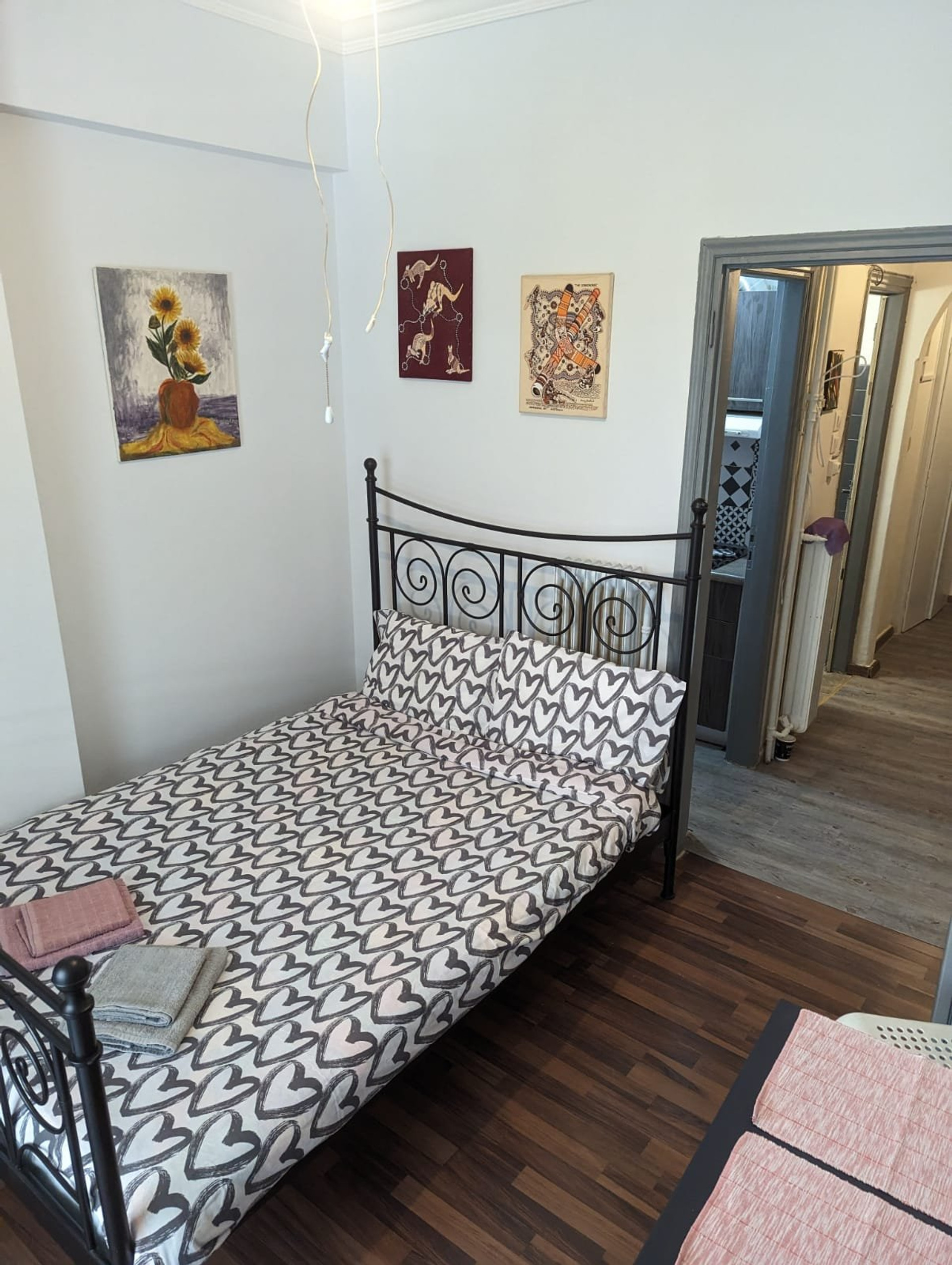 Bedroom with iron bed and hallway