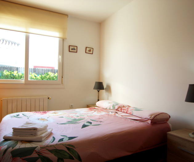 Cozy bedroom with twin lamps