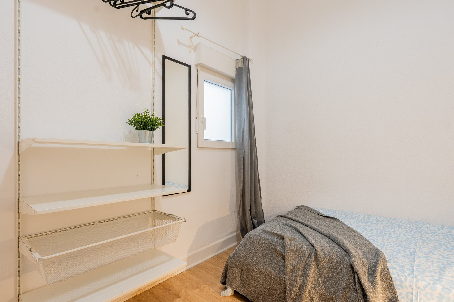 Bedroom with shelving and single bed
