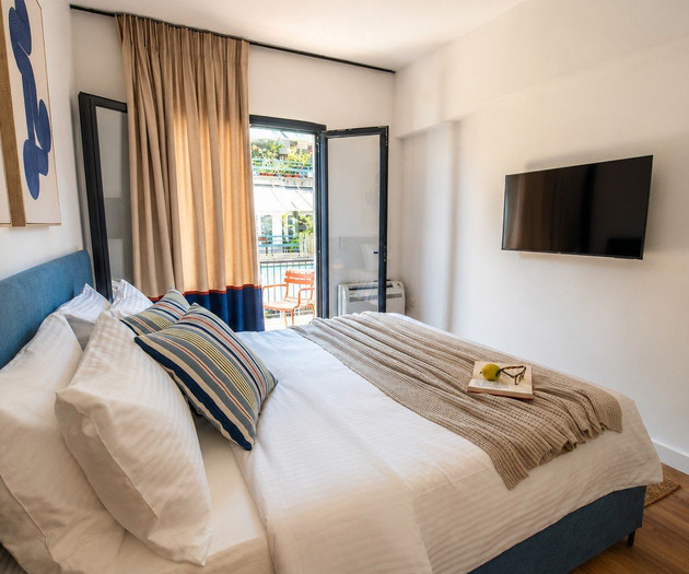 Bedroom with balcony pool view