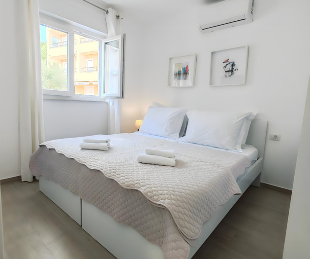 Bright bedroom with double bed