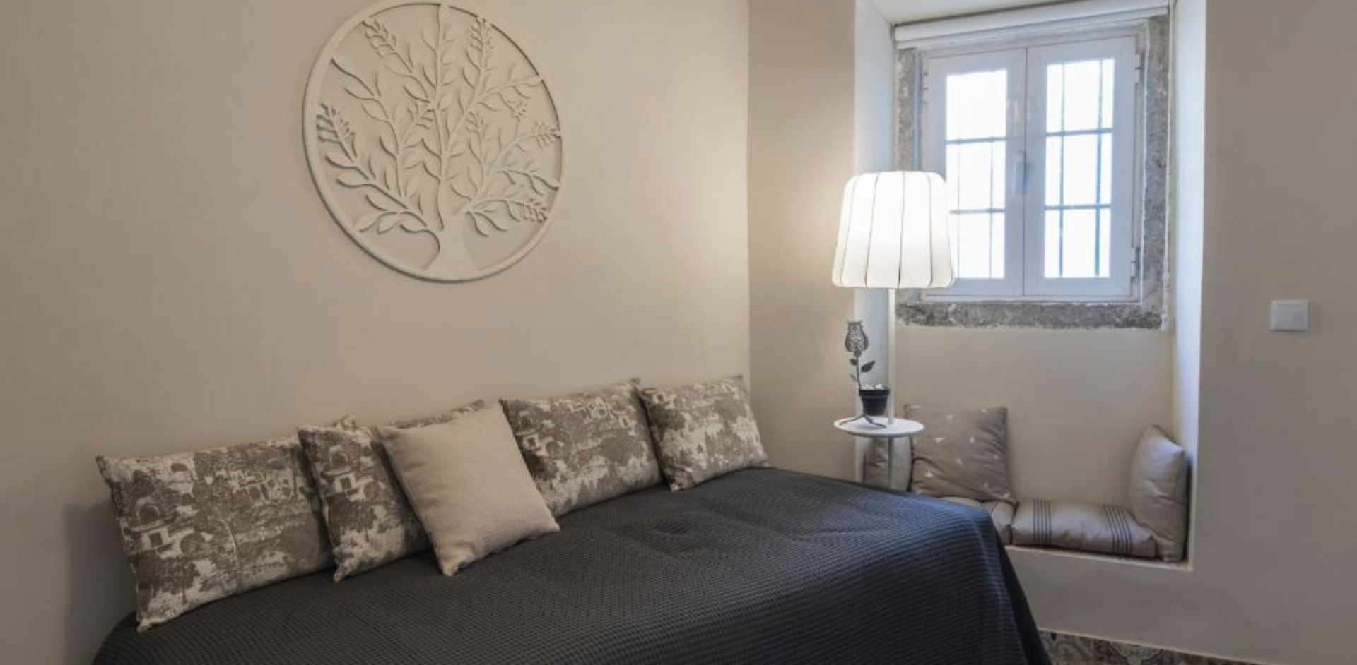 Cozy bed with decorative wall art