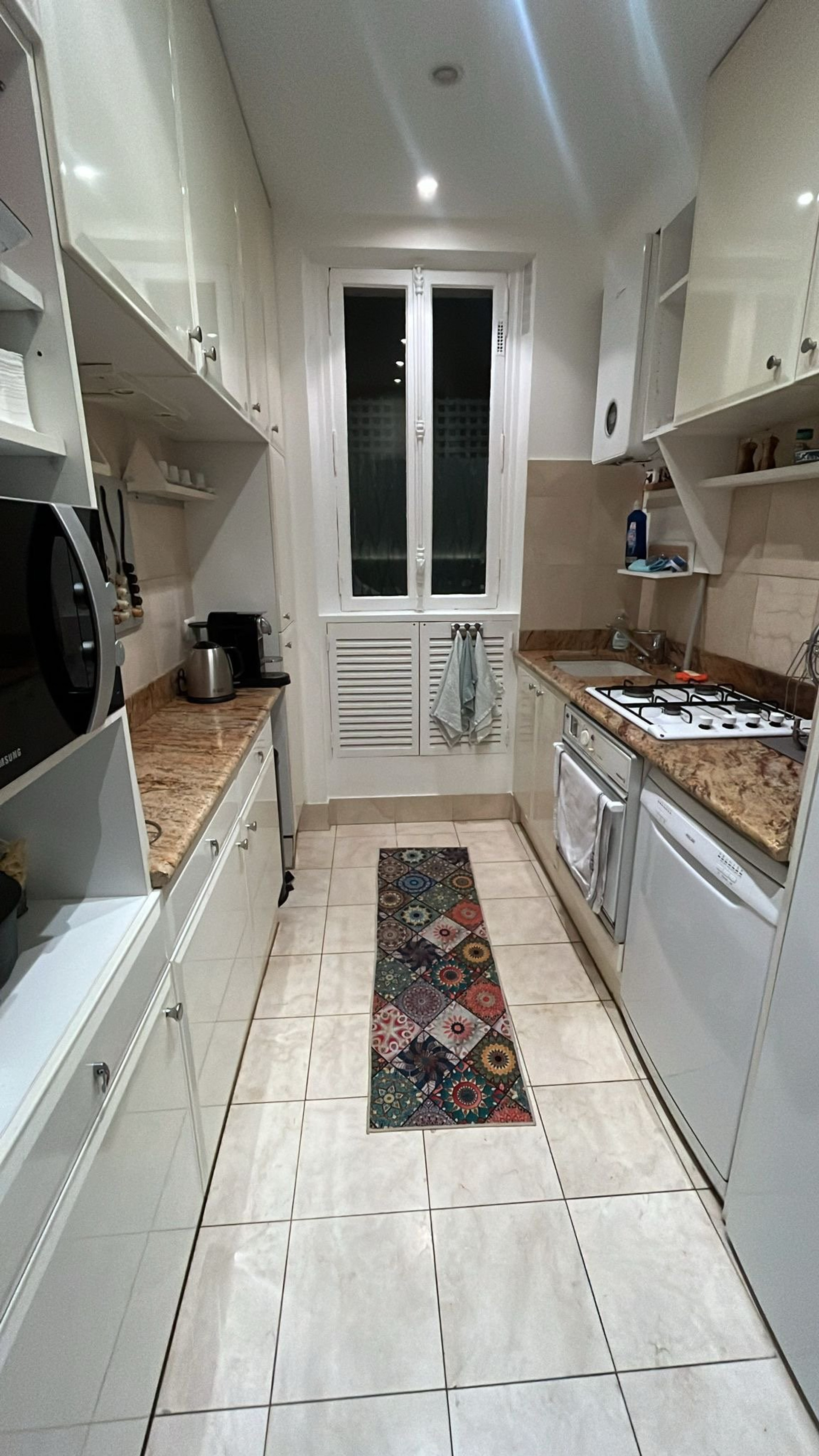 Galley kitchen with granite counters