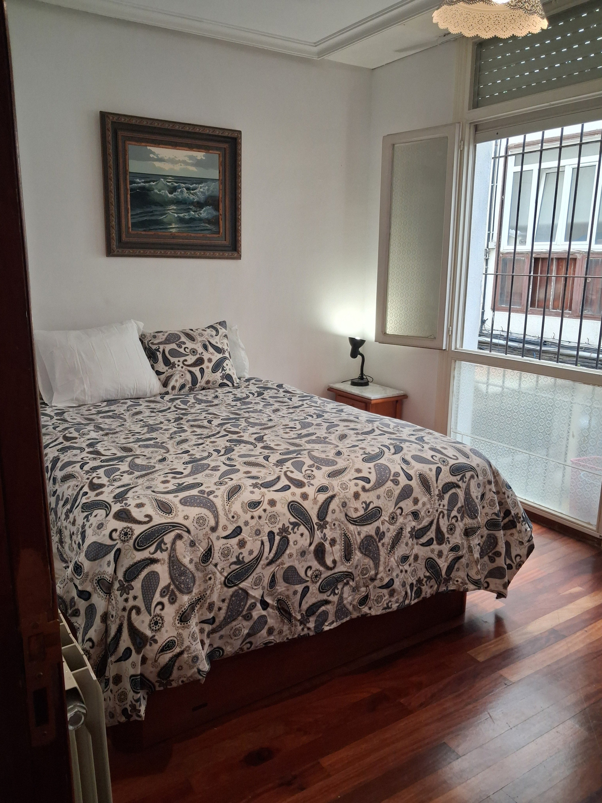 Double bed with barred window