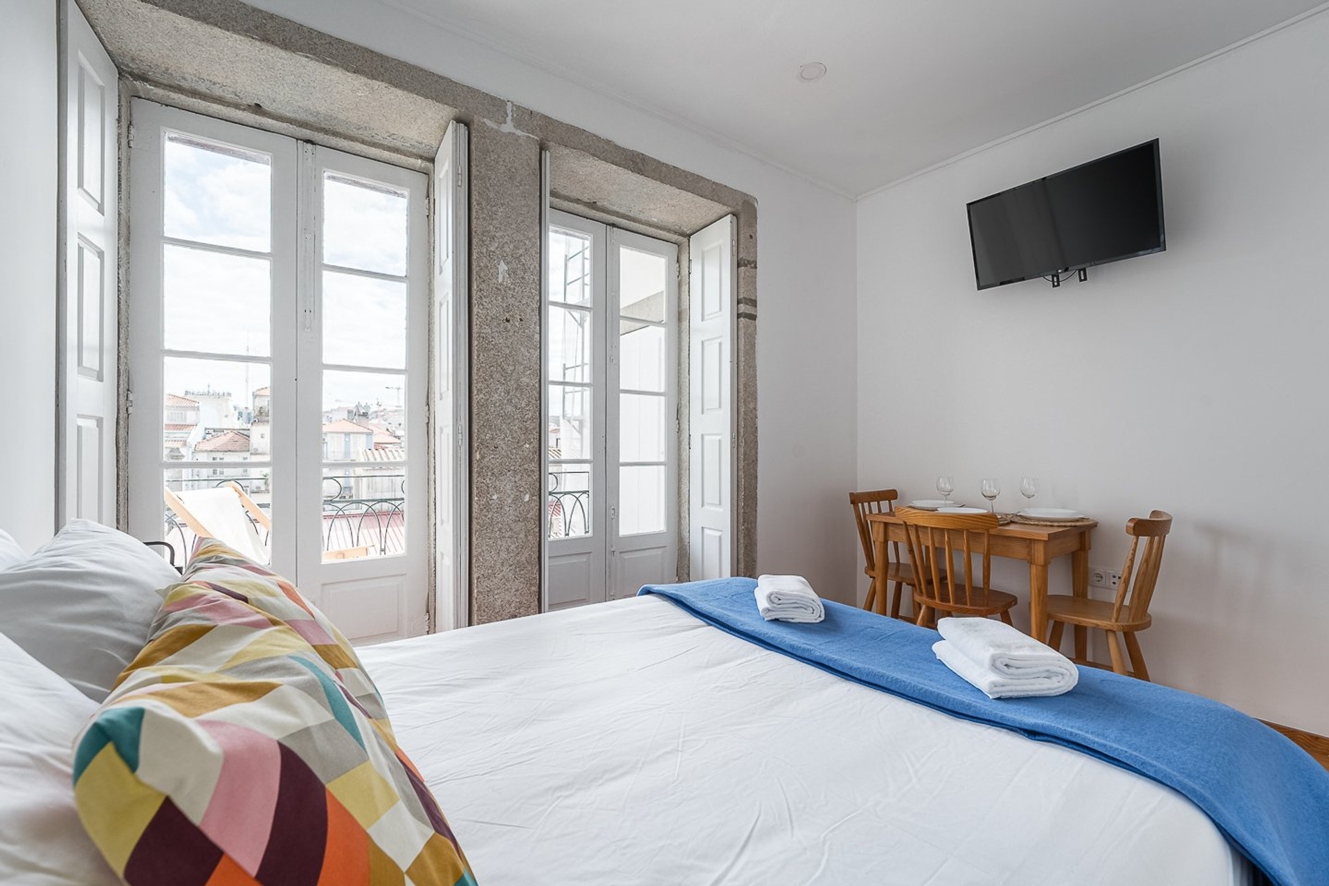 Bedroom with dining area and TV