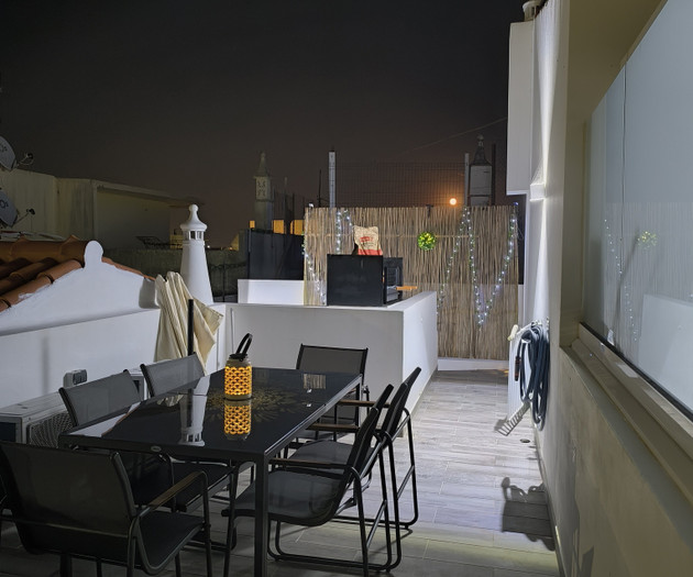 Terrace dining area at night