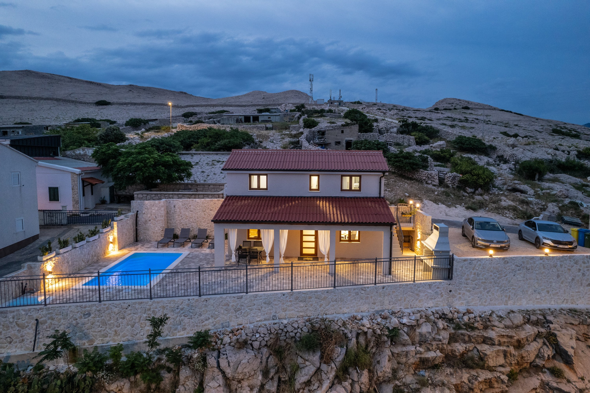 Evening view villa exterior pool