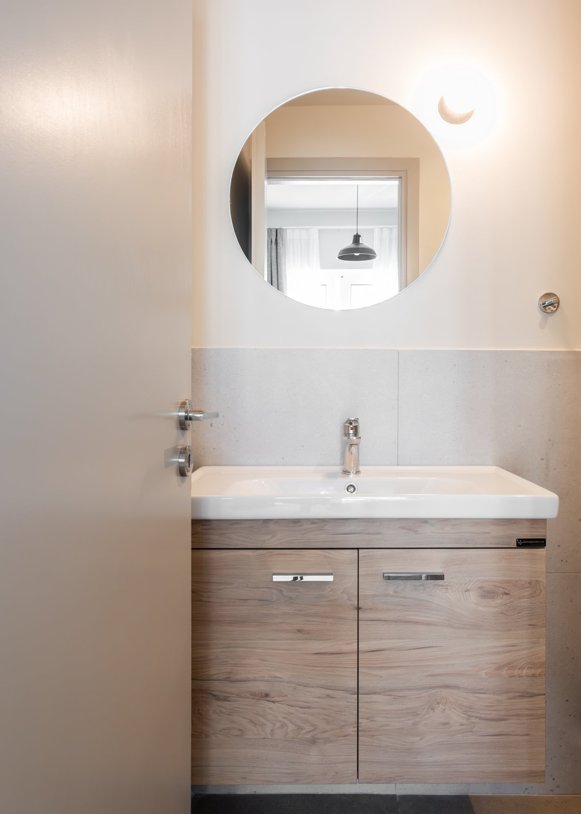 Bathroom vanity with round mirror