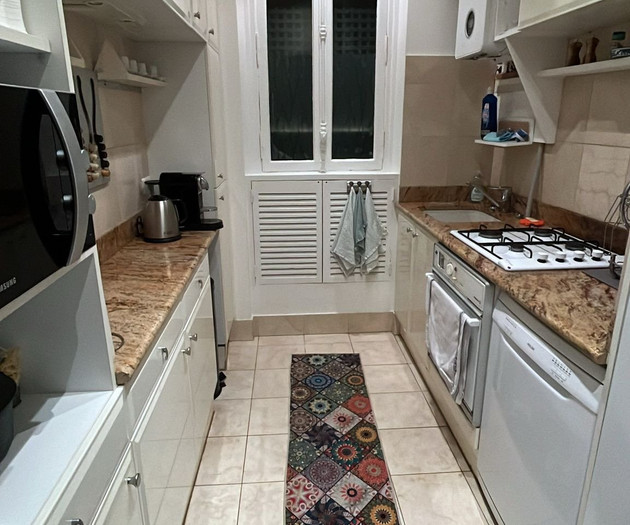 Galley kitchen with granite counters