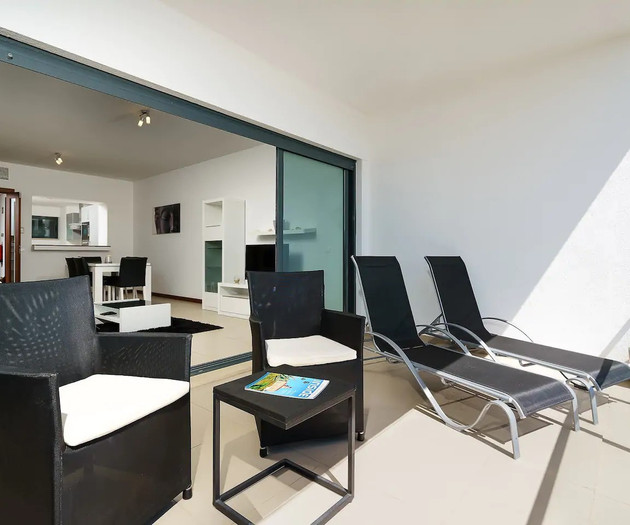 Balcony lounge chairs overlooking living room