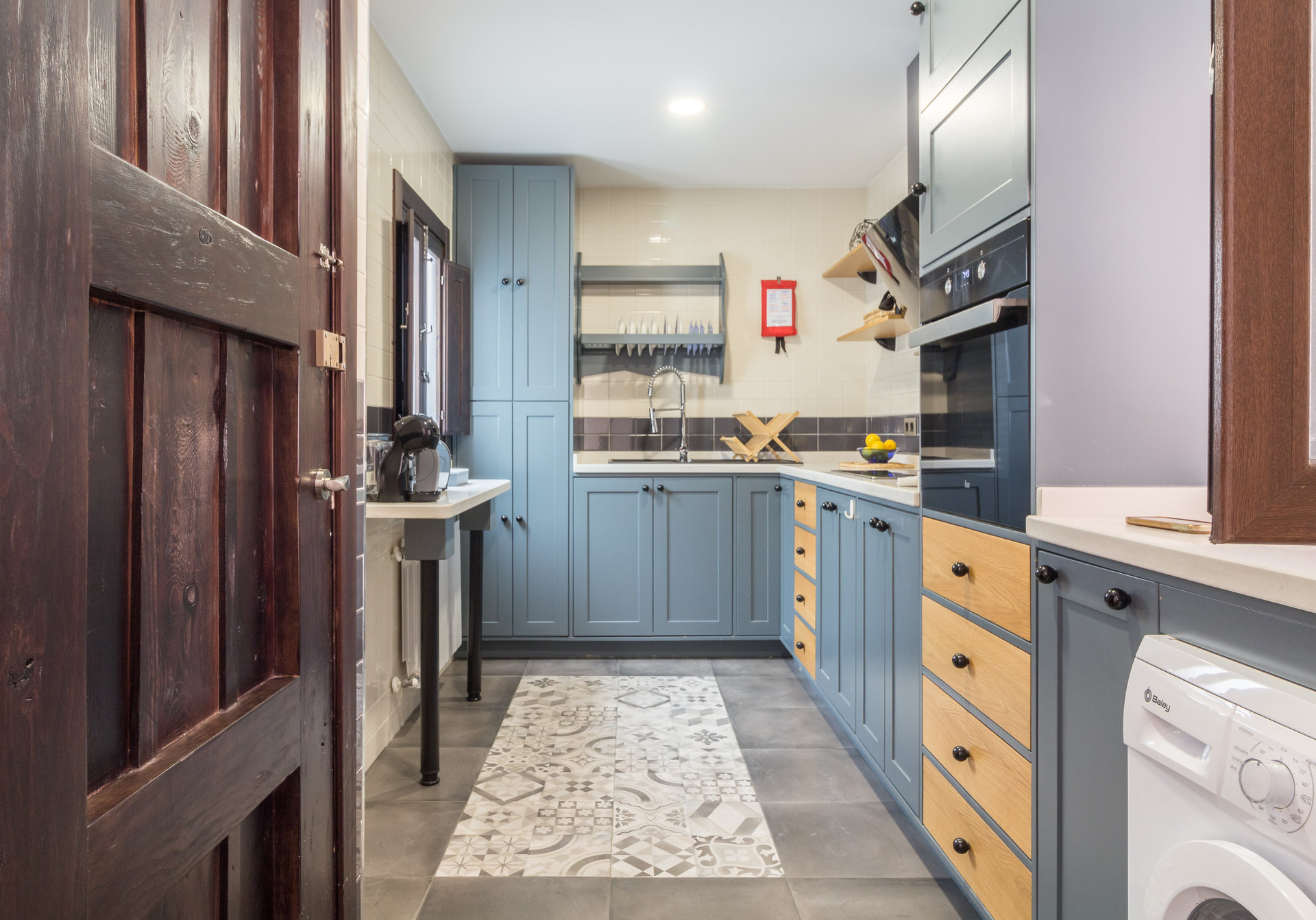 Blue kitchen with appliances