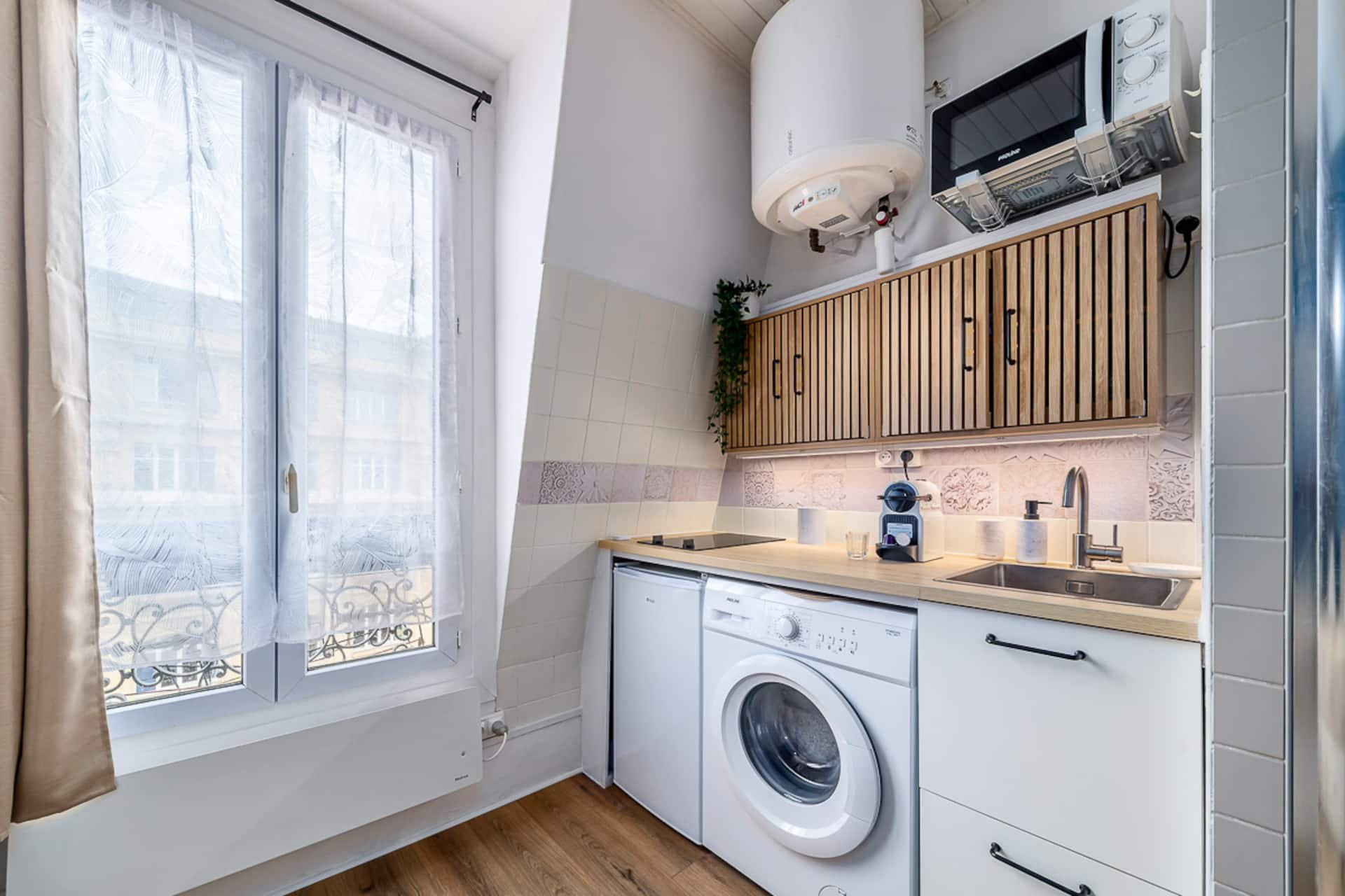 Kitchenette with washer and window