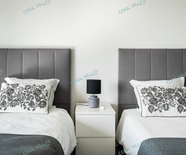 Twin beds with floral pillows