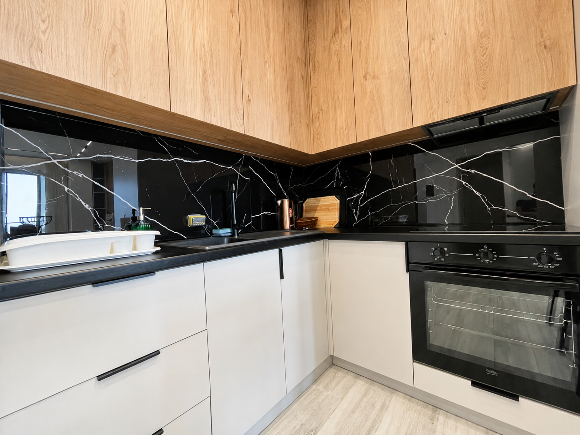 Kitchen black marble backsplash and oven