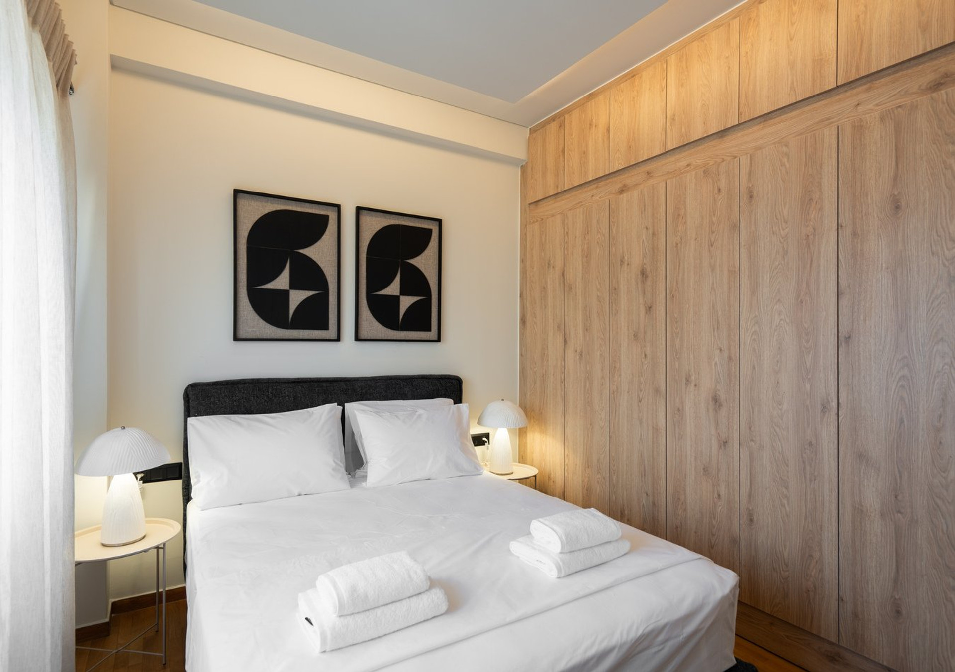 Bedroom with wardrobe and art
