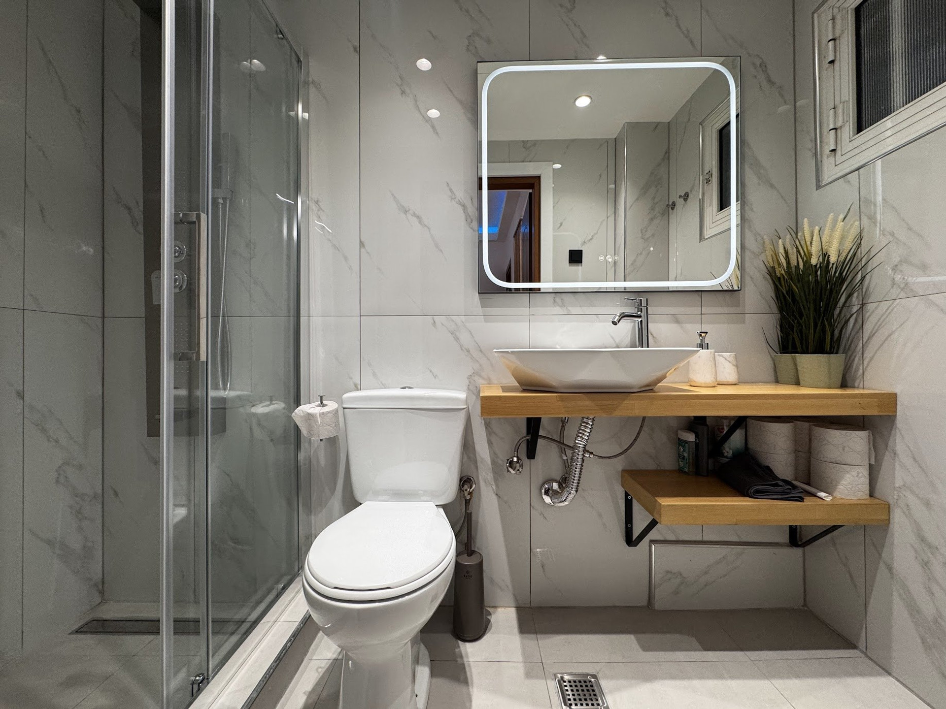 Full bathroom with shower and vanity