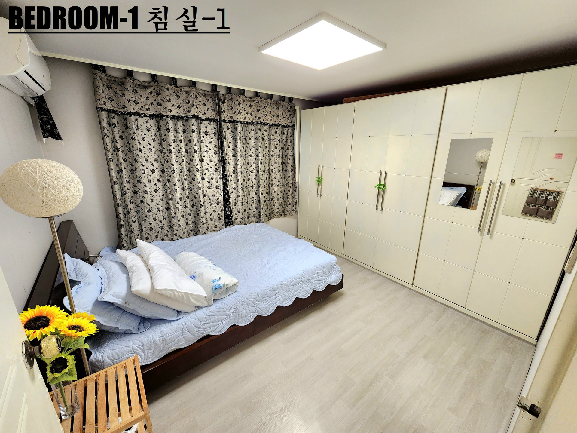 Bedroom with bed, closet