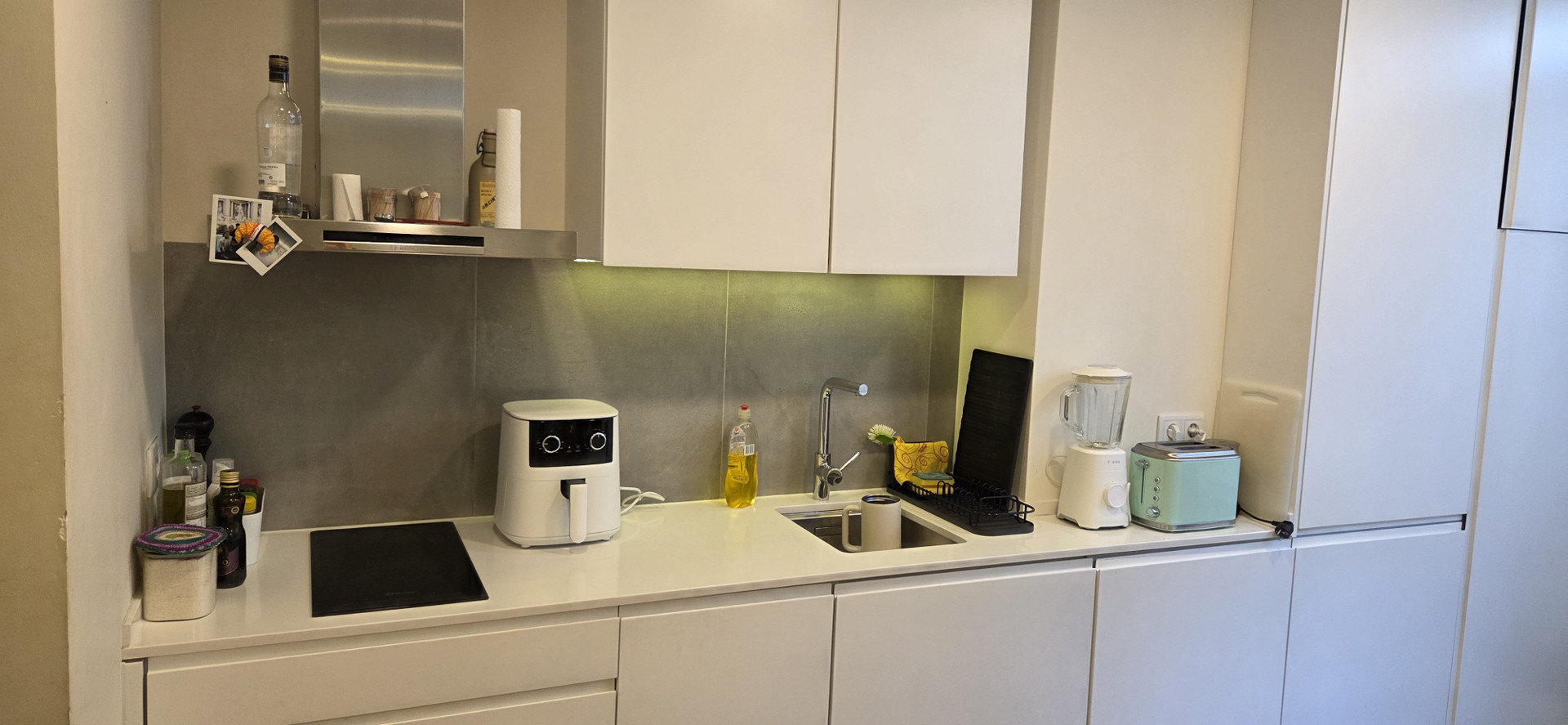Modern white kitchen with appliances