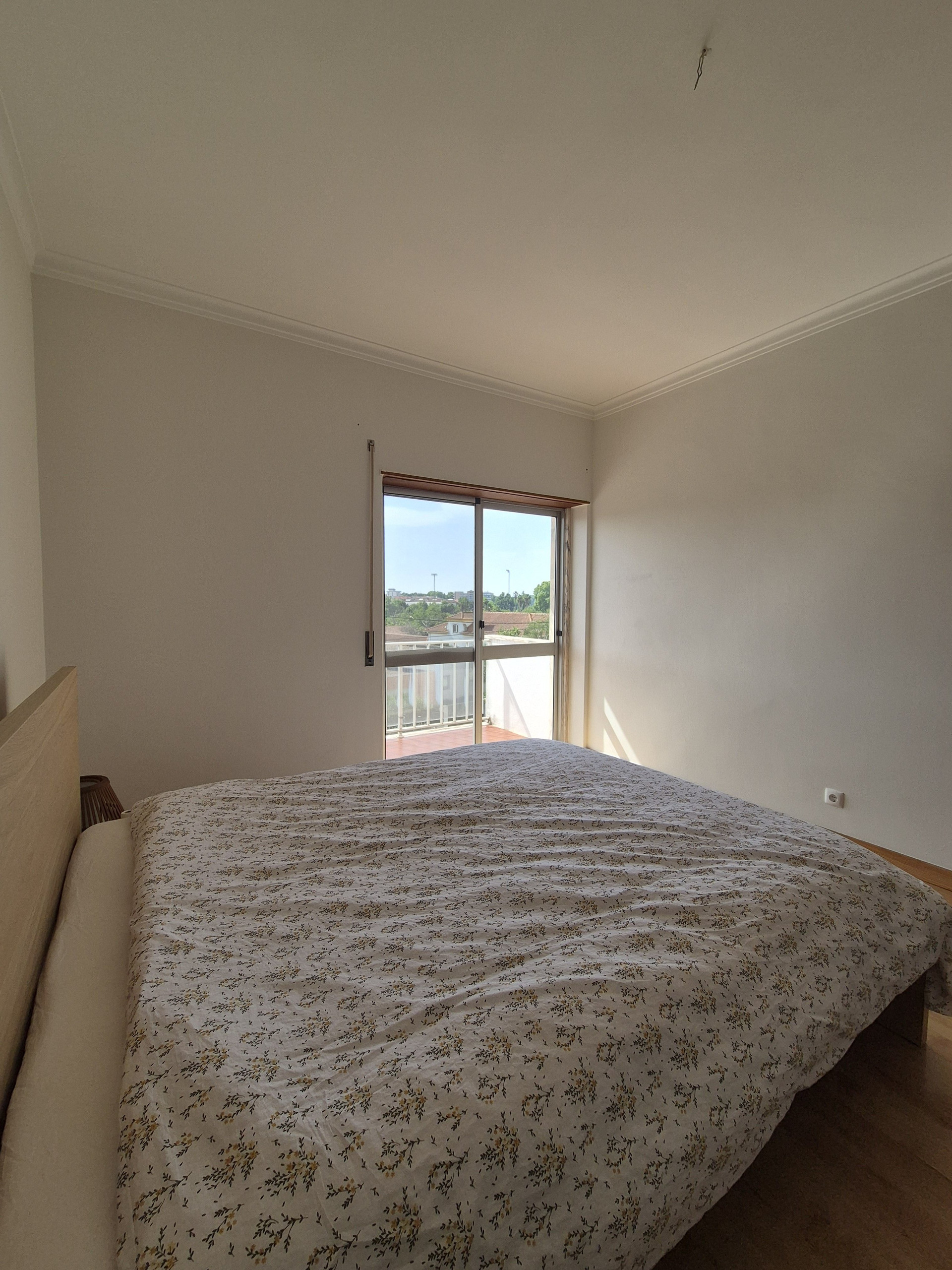 Large bedroom with balcony and build in closet