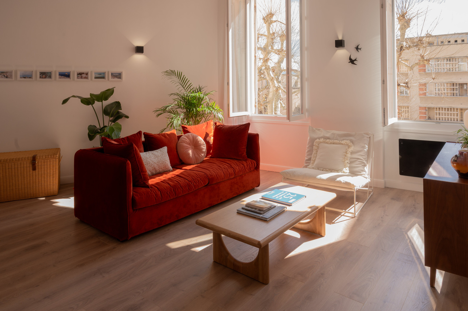 Bright living room with red sofa