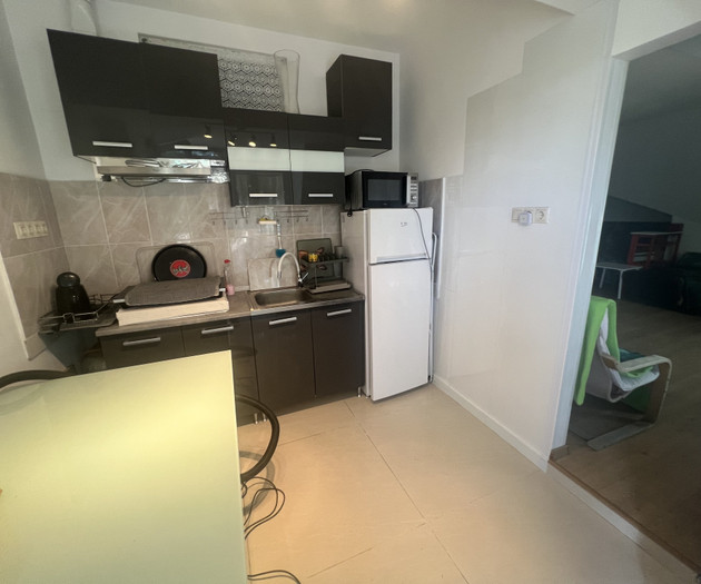 Kitchen with fridge and stove