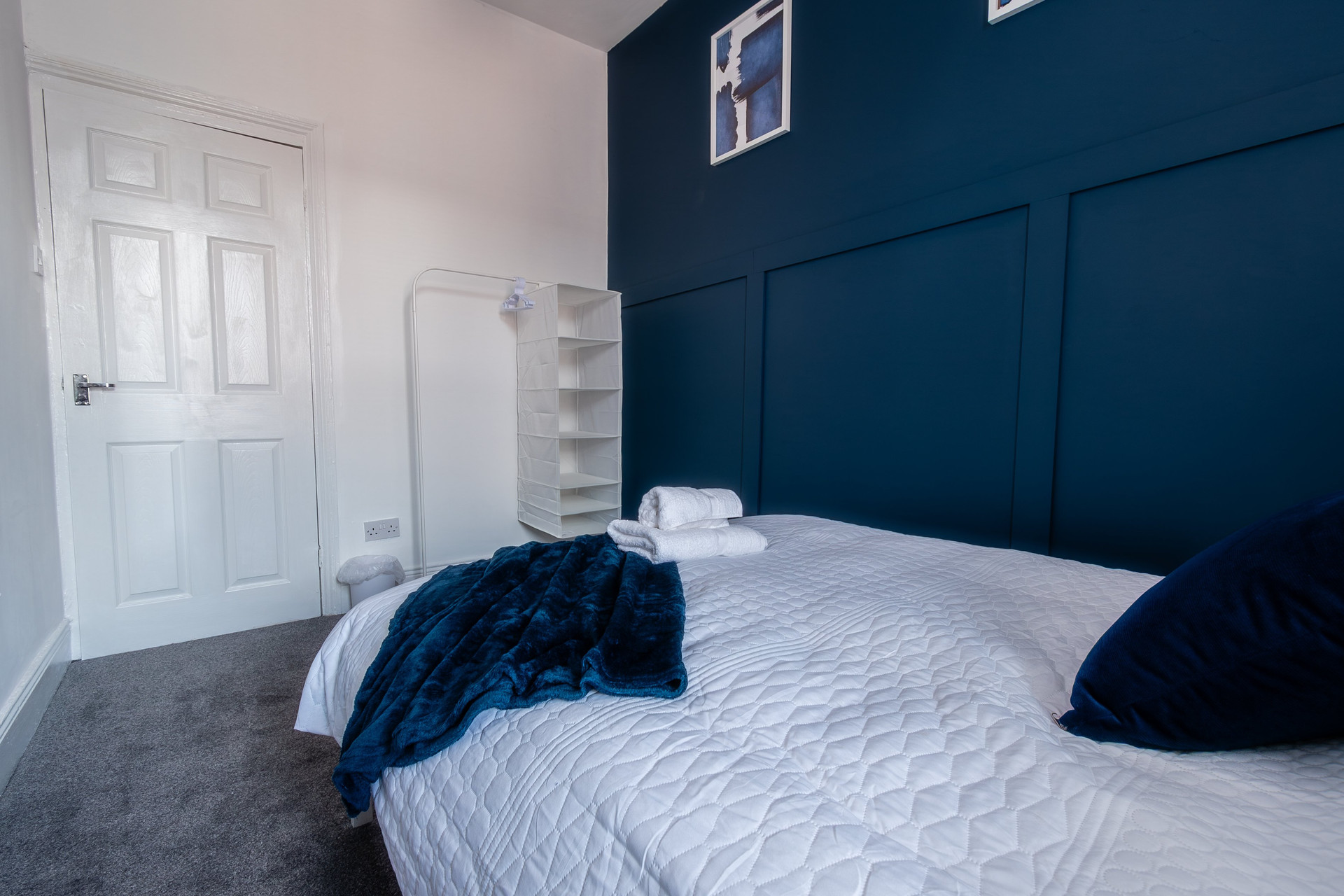 Bedroom with navy accent wall