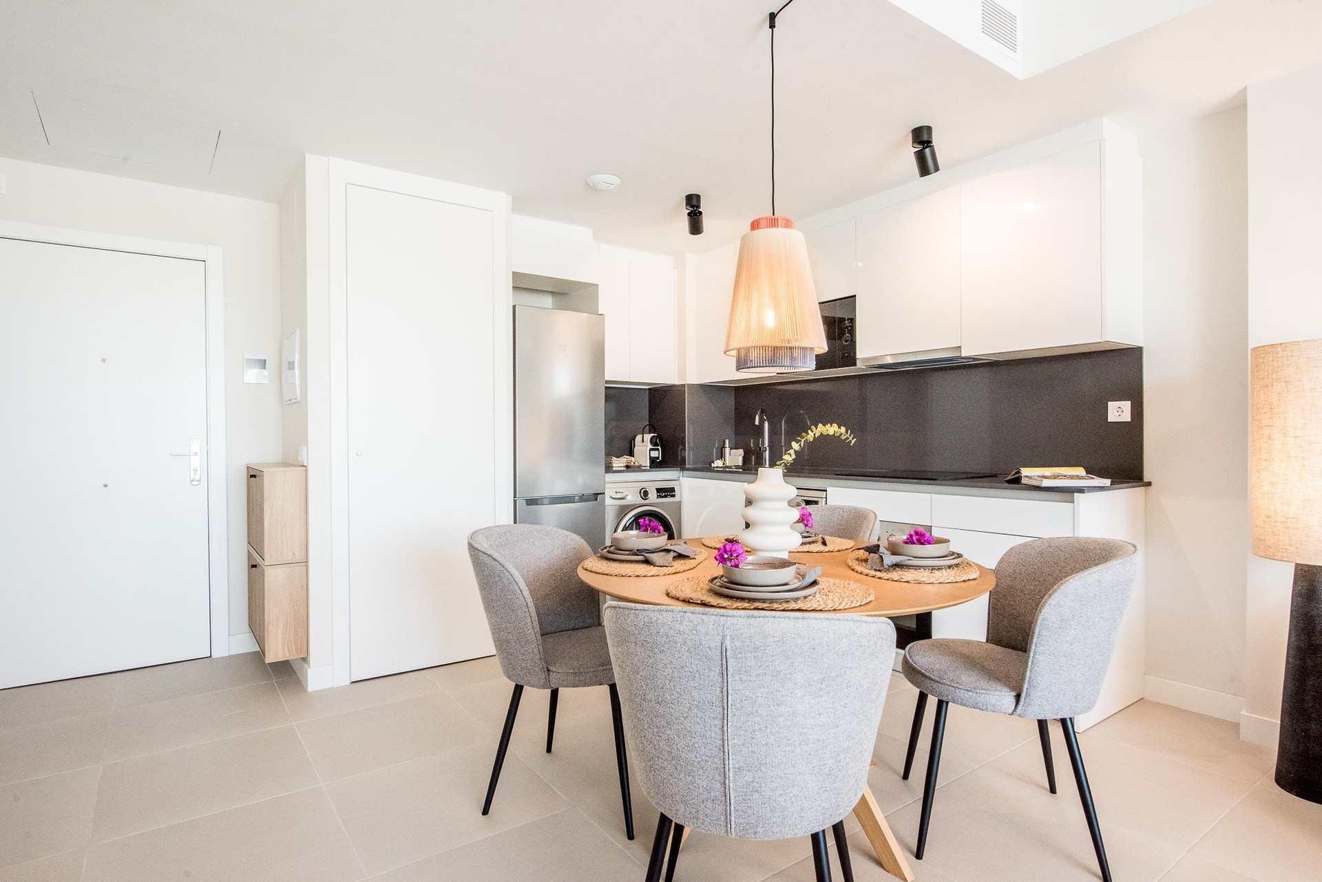 Dining area with kitchen behind