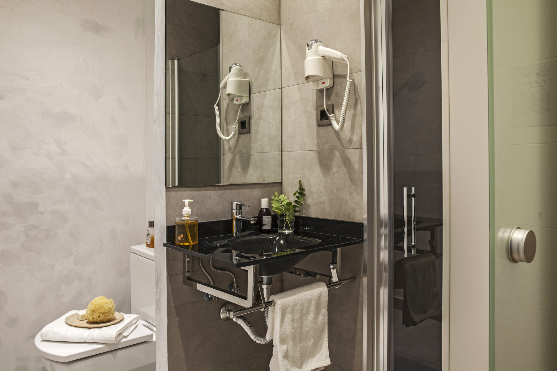 Modern bathroom with black marble sink