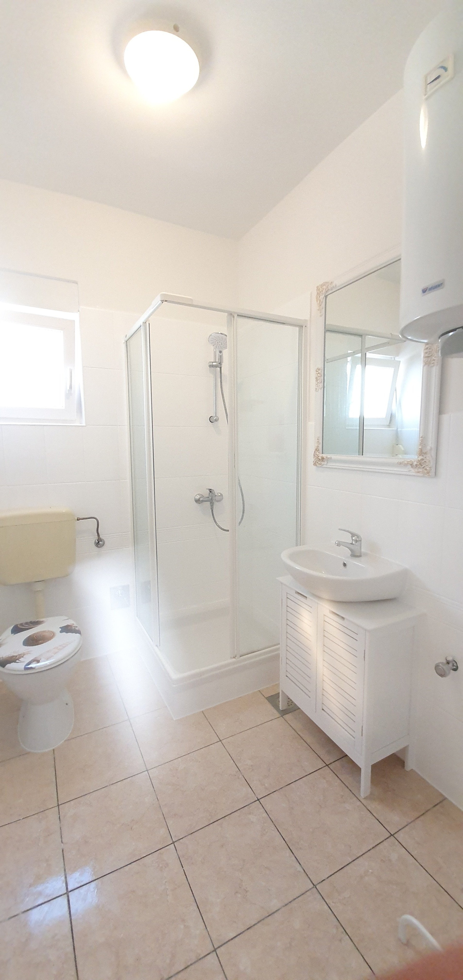 Bathroom with shower and sink