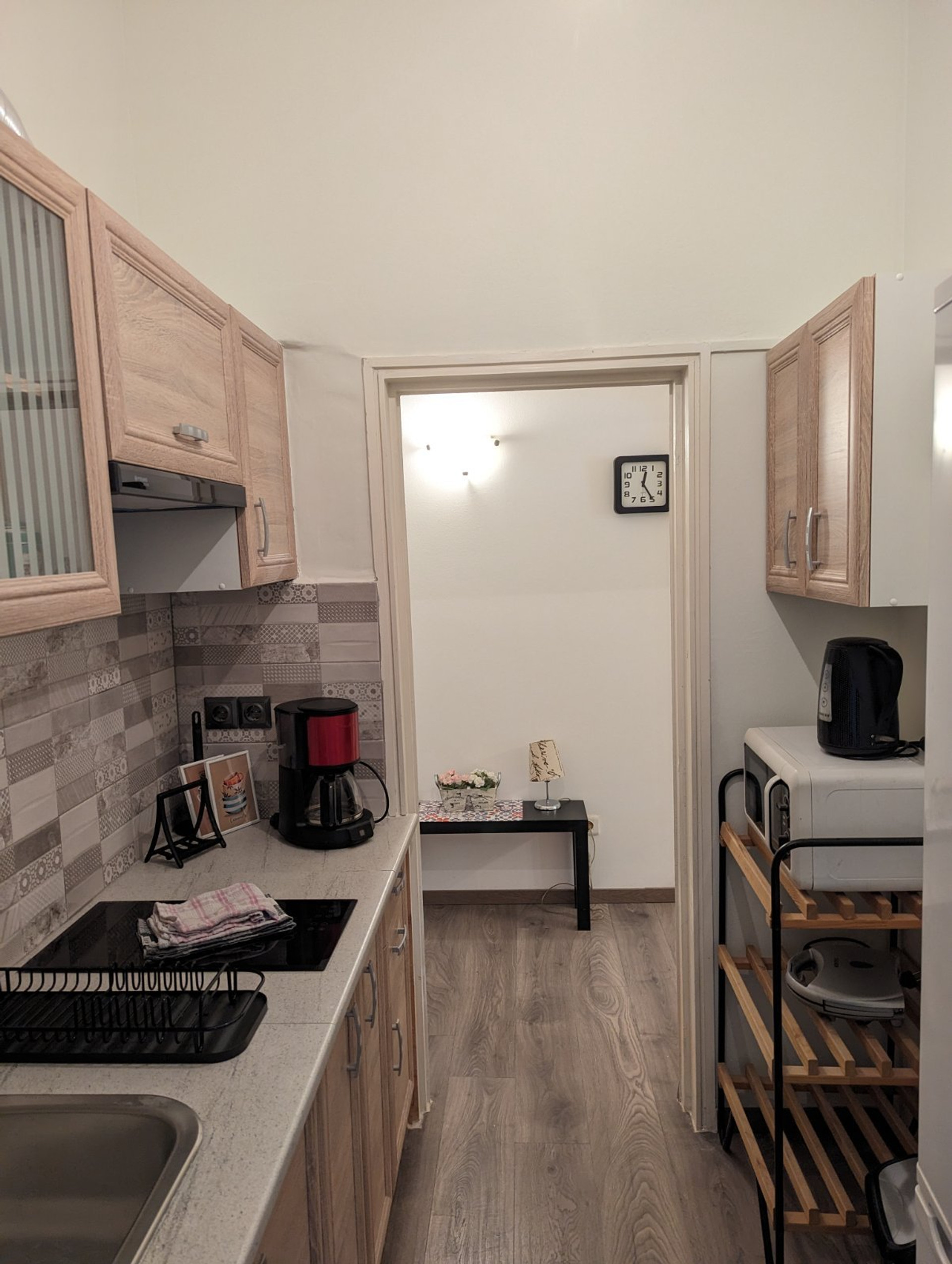 Compact kitchen with wood cabinets
