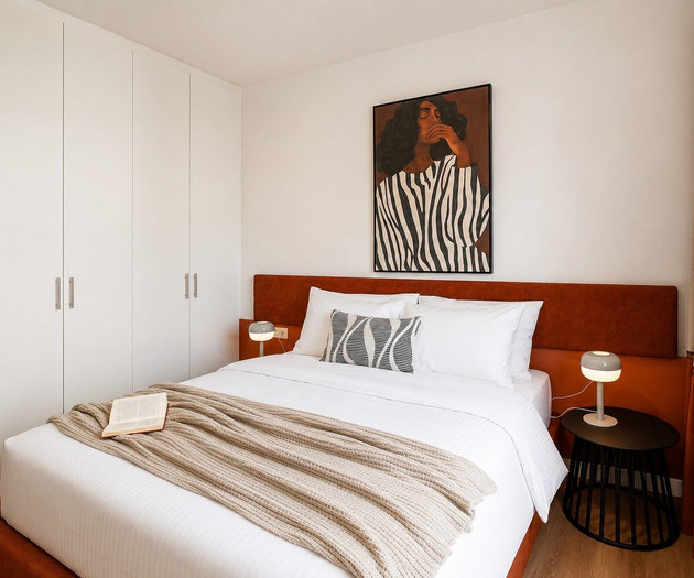 Bedroom with artistic wall portrait