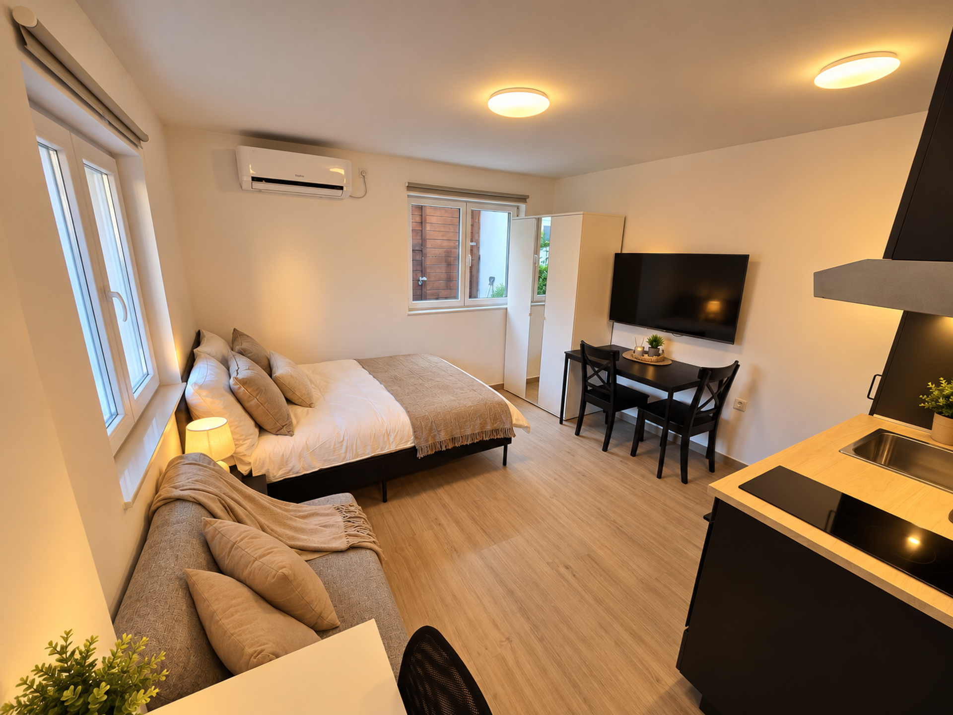 Open studio with bed and kitchen