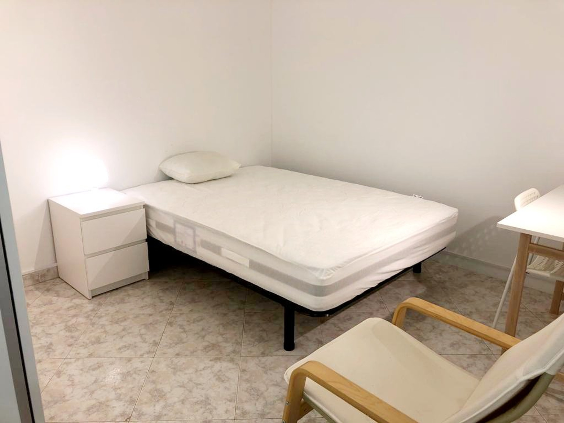 Bright bedroom with single bed