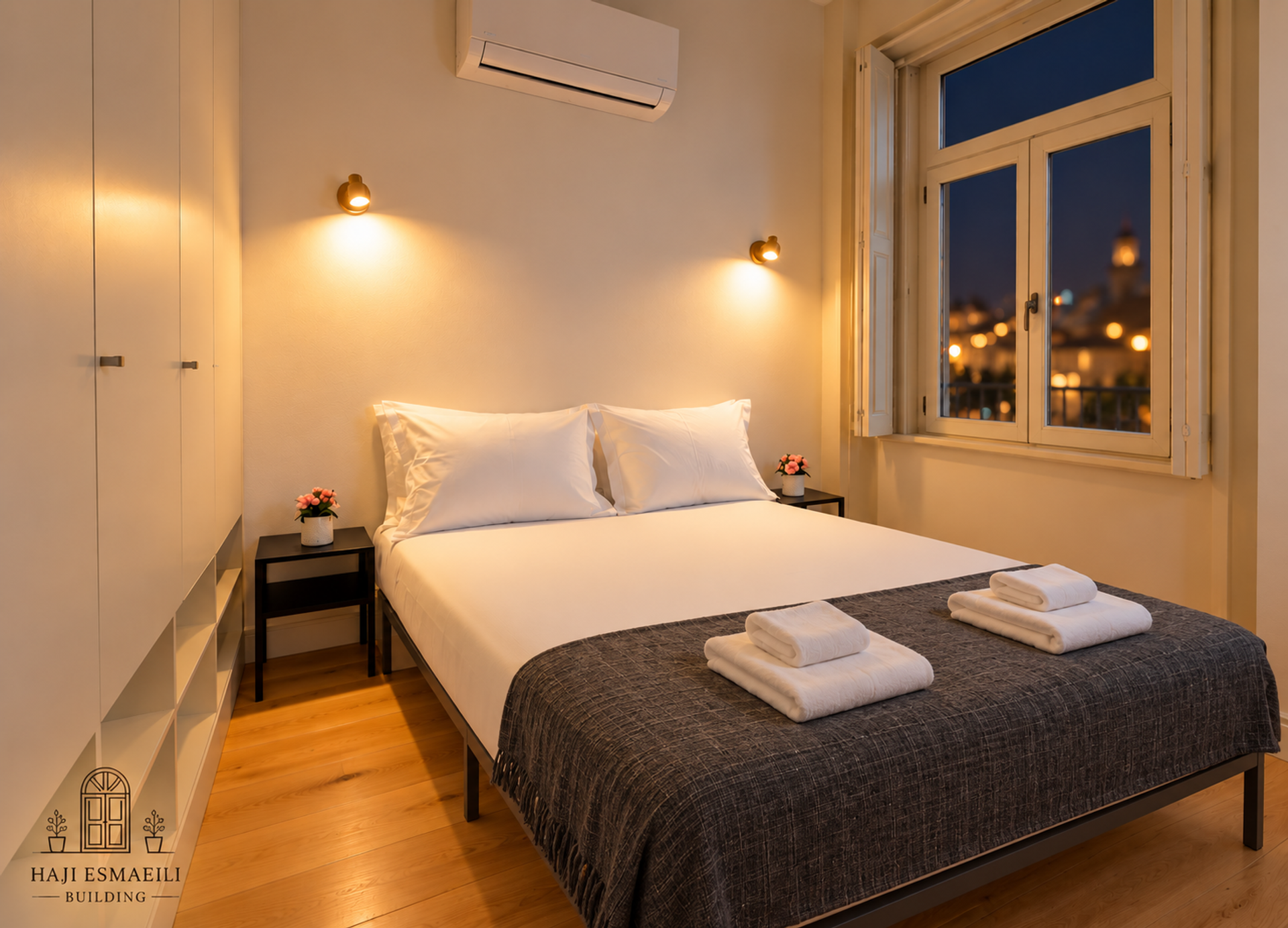Bedroom with grey throw, city view