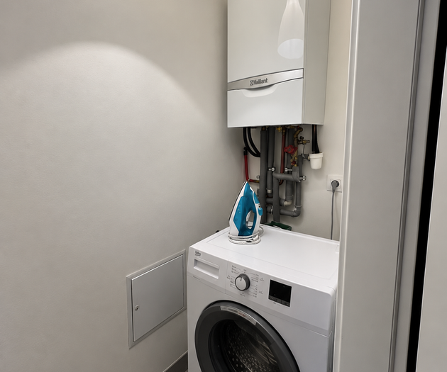 Laundry area with washer