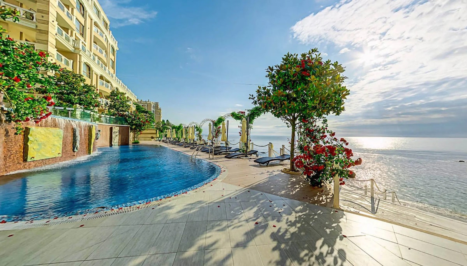Exterior + pool + beach