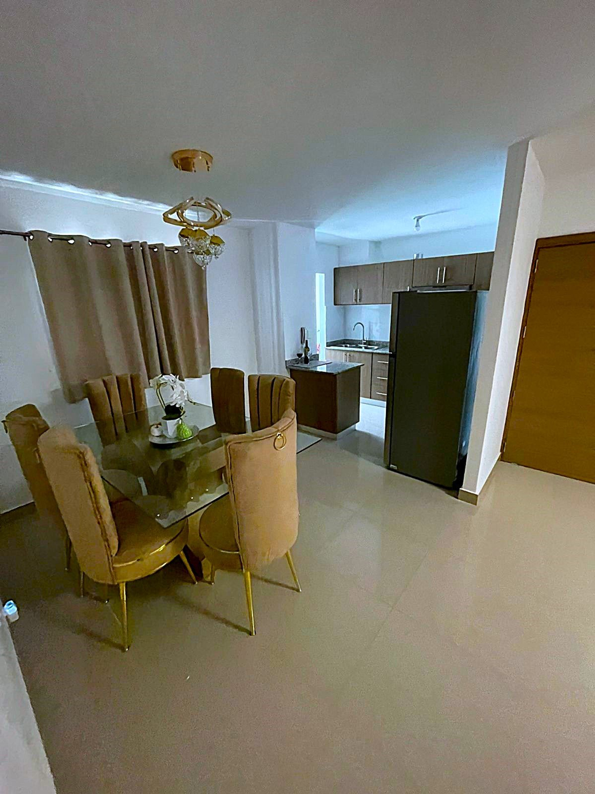 Dining area near kitchen and entrance