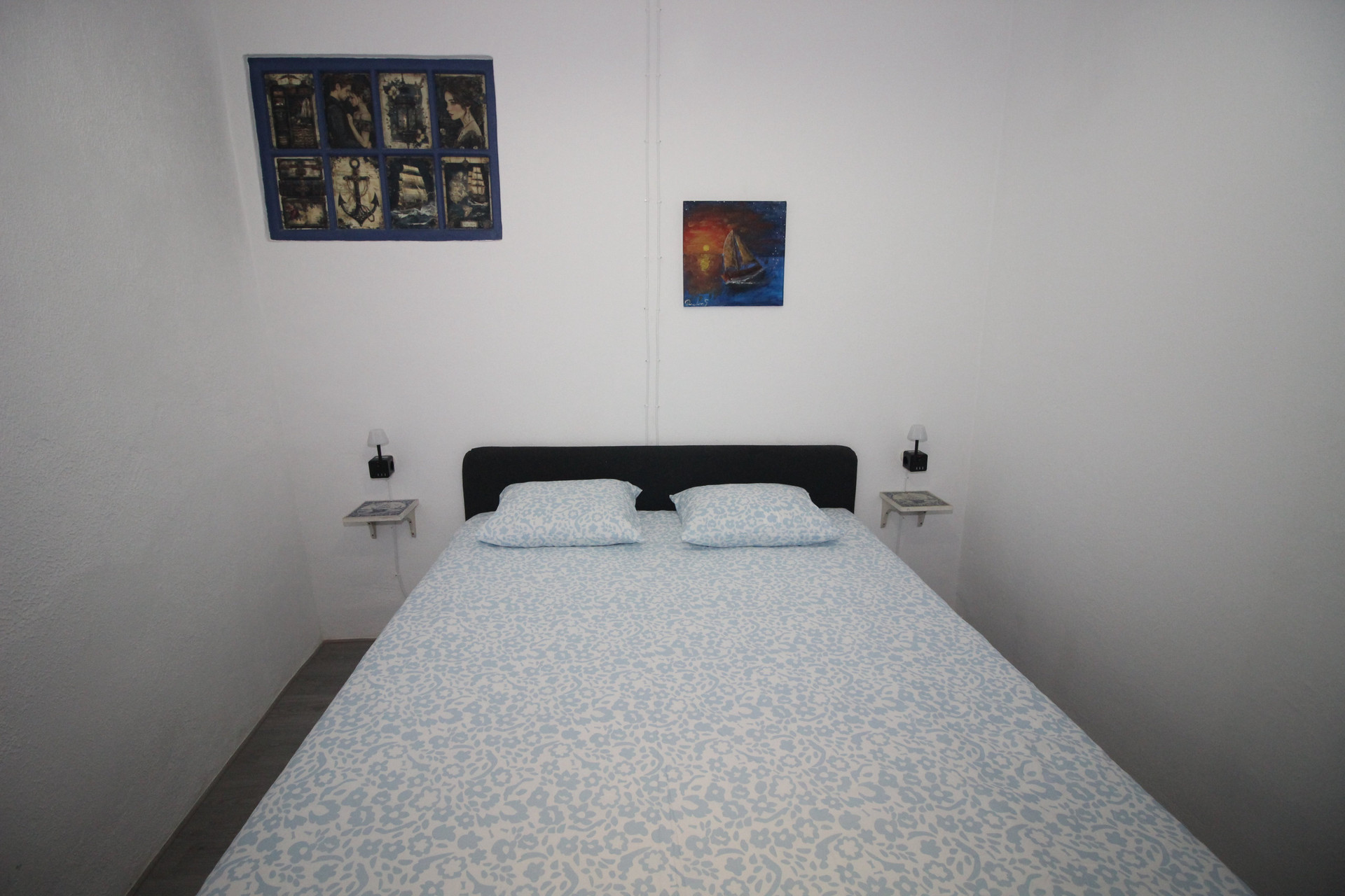 Bedroom with blue patterned bedding
