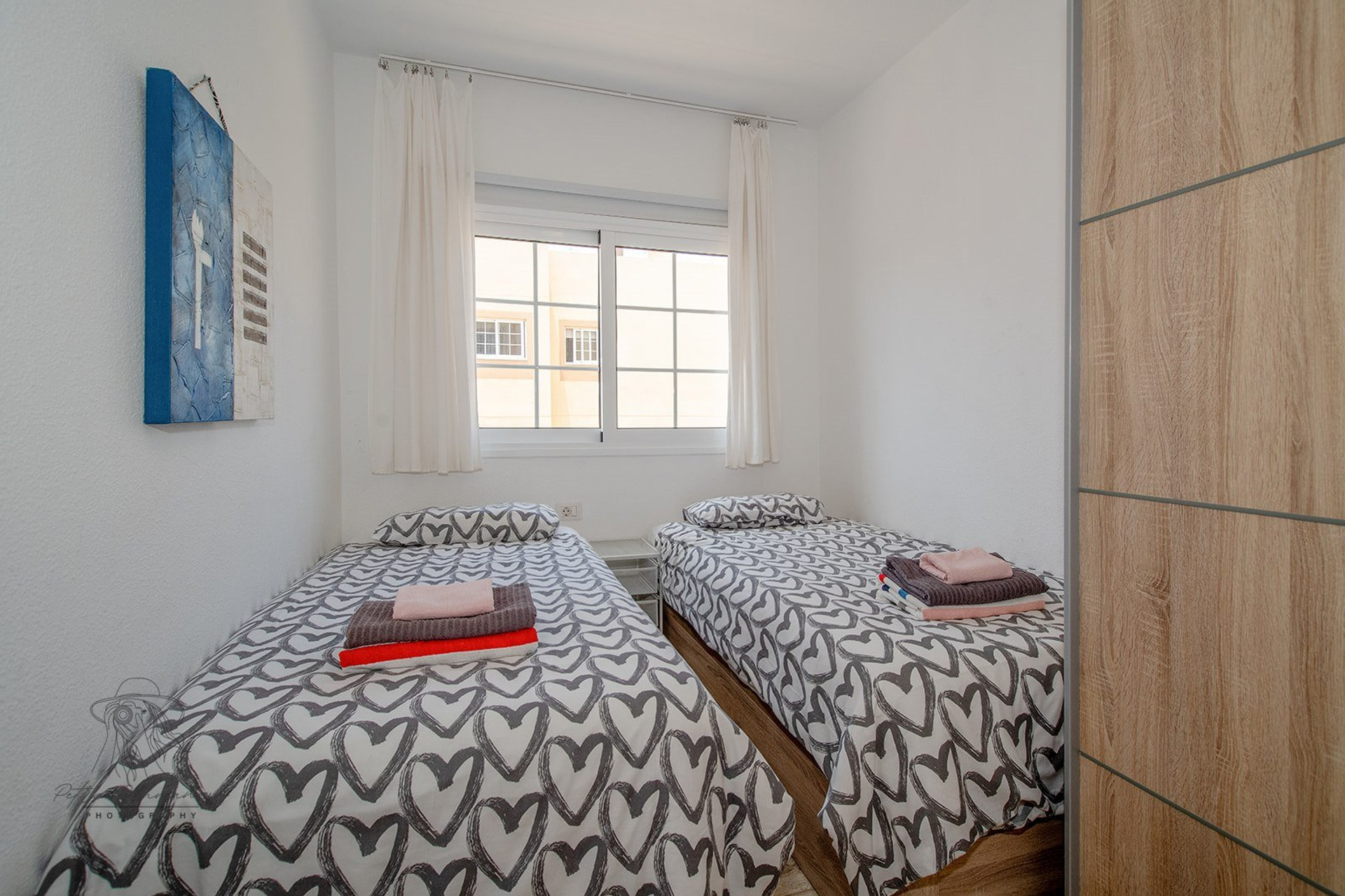 Twin bedroom with wardrobe