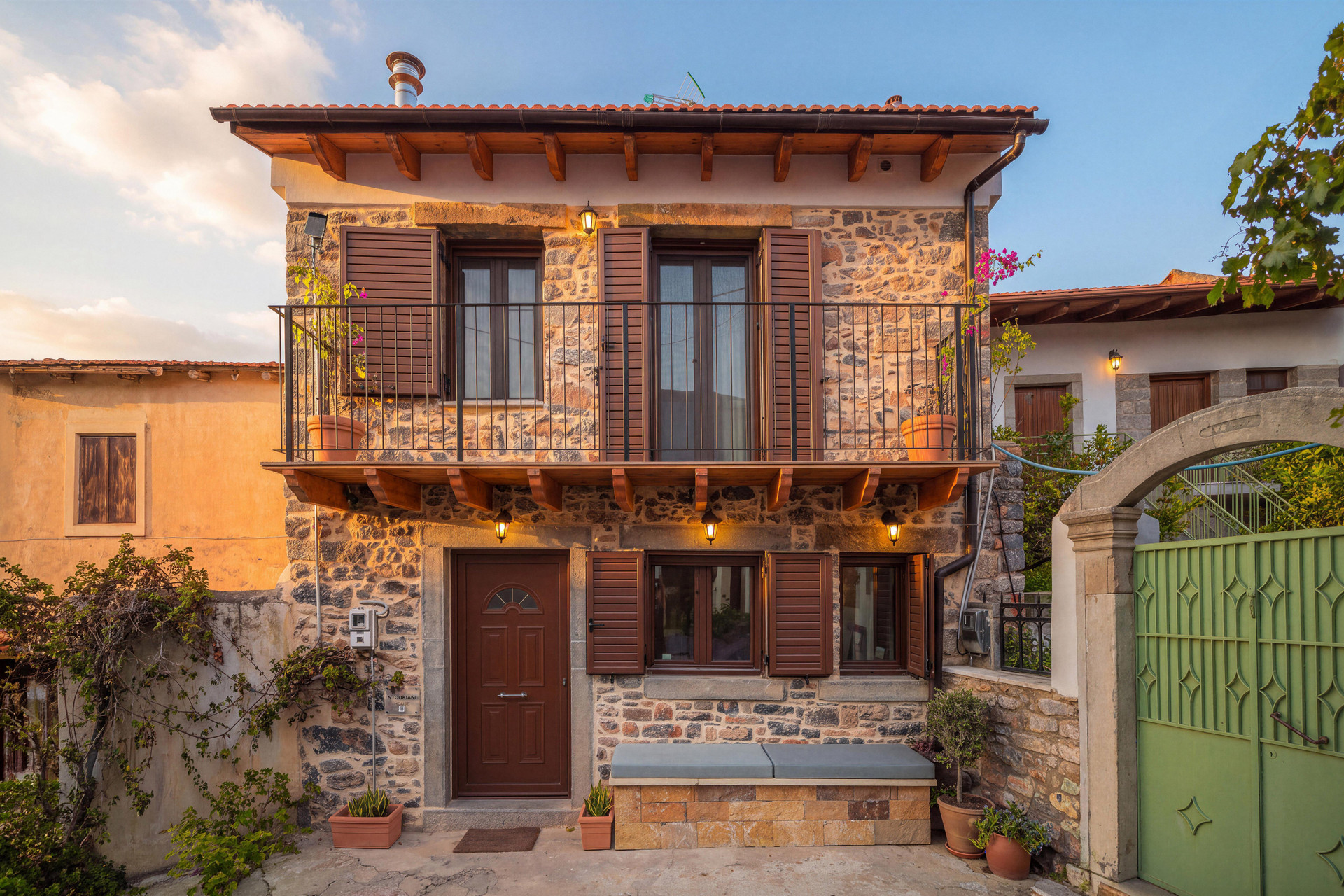 Stone house facade with balcony
