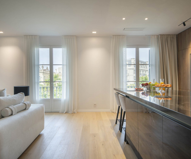 Living area with balcony windows