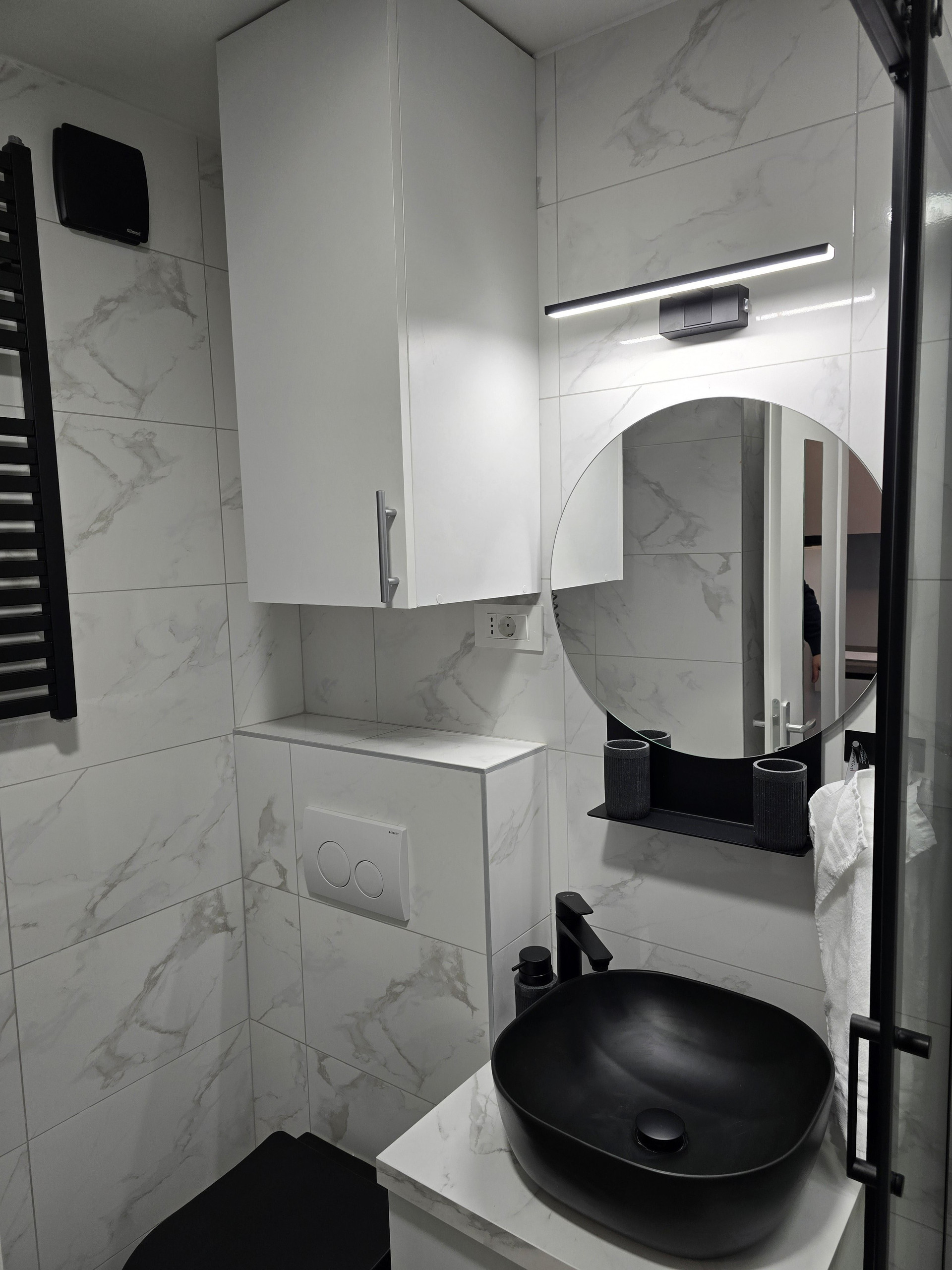 Modern bathroom with black sink