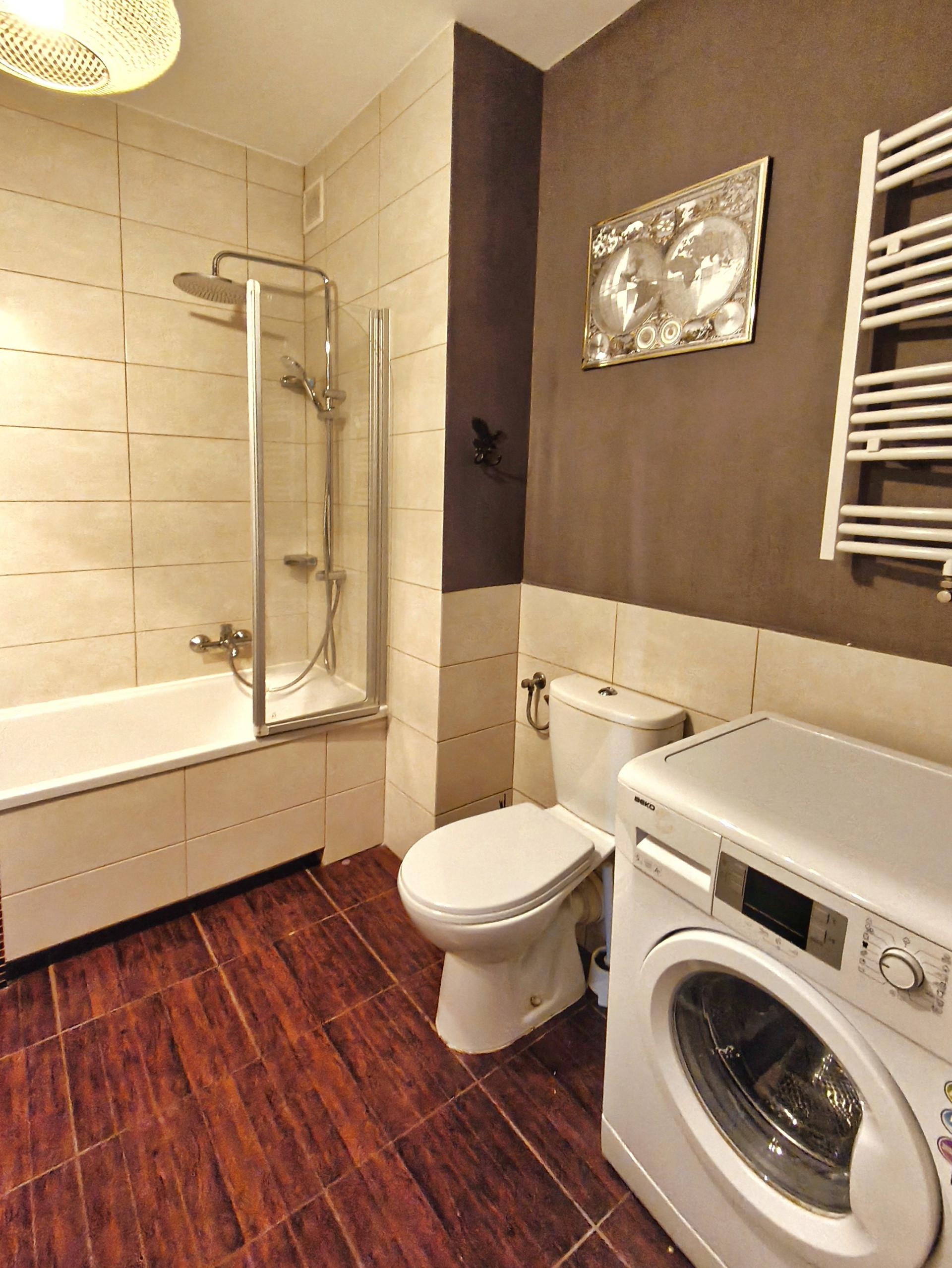 Bathroom with tub and washer