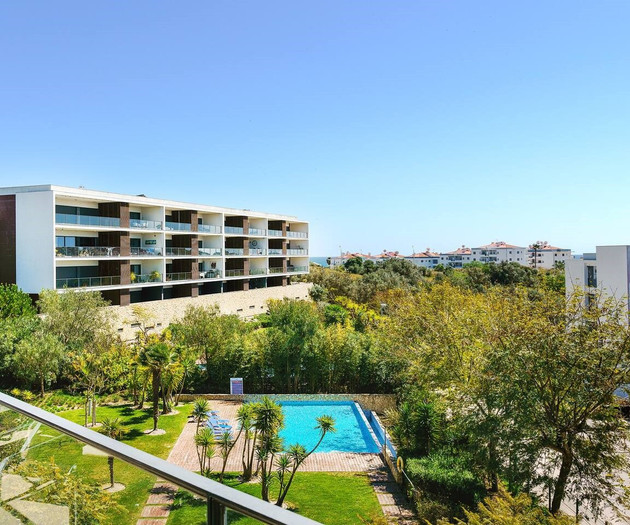 Balcony view of pool and building