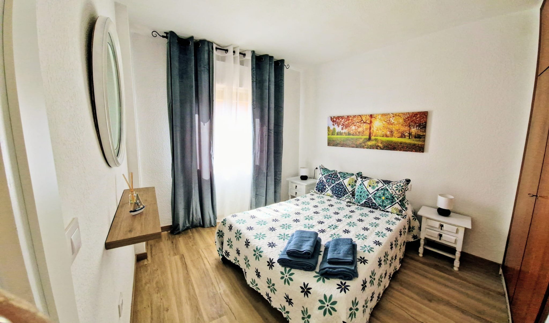 Bedroom with double bed and mirror