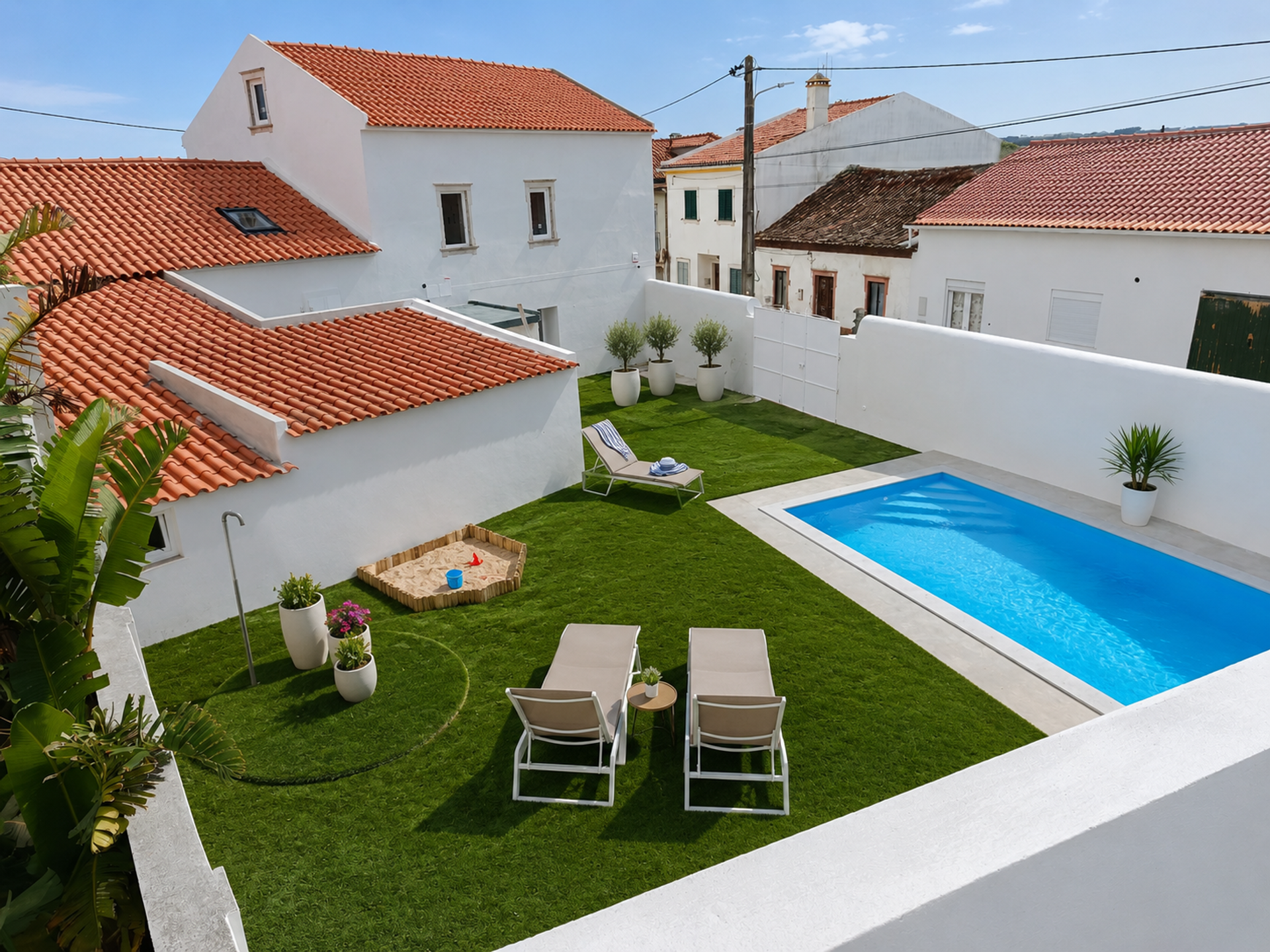 Rooftop pool with lounge chairs and garden